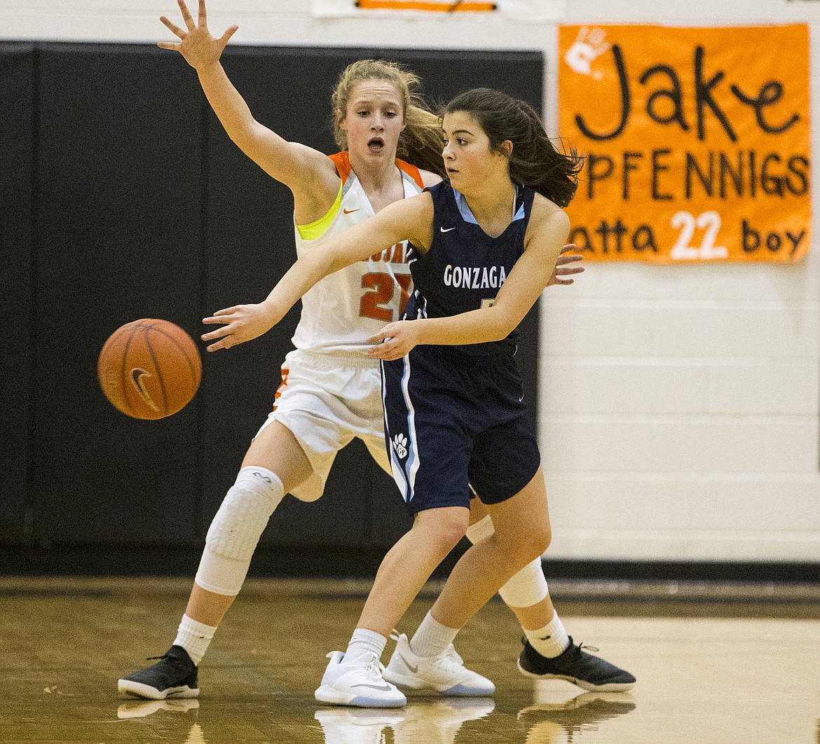 LOREN BENOIT/Press

Gonzaga Prep&#146;s Grace Hammon passes the ball around Post Falls defender Tyler McCliment-Call Thursday night at Post Falls High School.