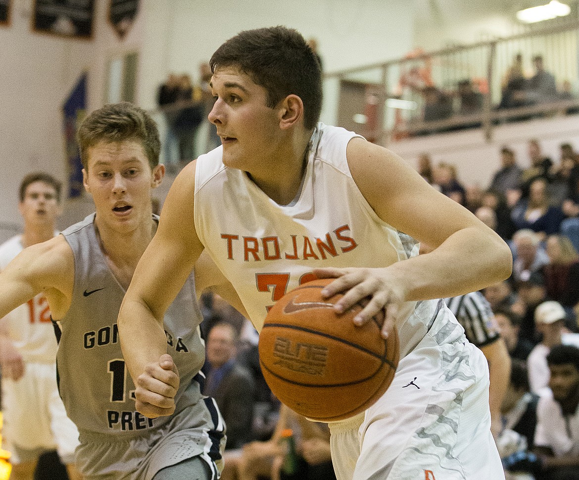 LOREN BENOIT/PressGavven Desjarlais dribbles the ball under the basket against Gonzaga Prep Thursday night at Post Falls High School.