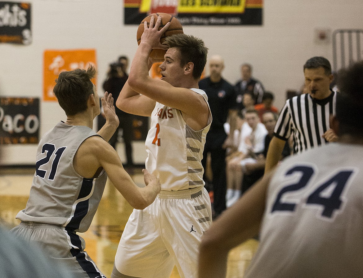 LOREN BENOIT/Press

David Bourgard looks to pass the ball to a teammate as Gonzaga Prep&#146;s Liam Lloyd applies pressure Thursday night at Post Falls High School.