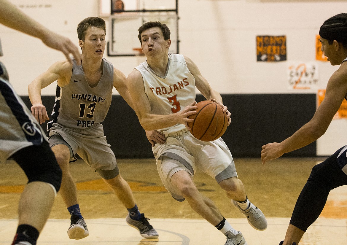 LOREN BENOIT/PressDrake Thompson drives into the Gonzaga Prep defense Thursday night at Post Falls High School.