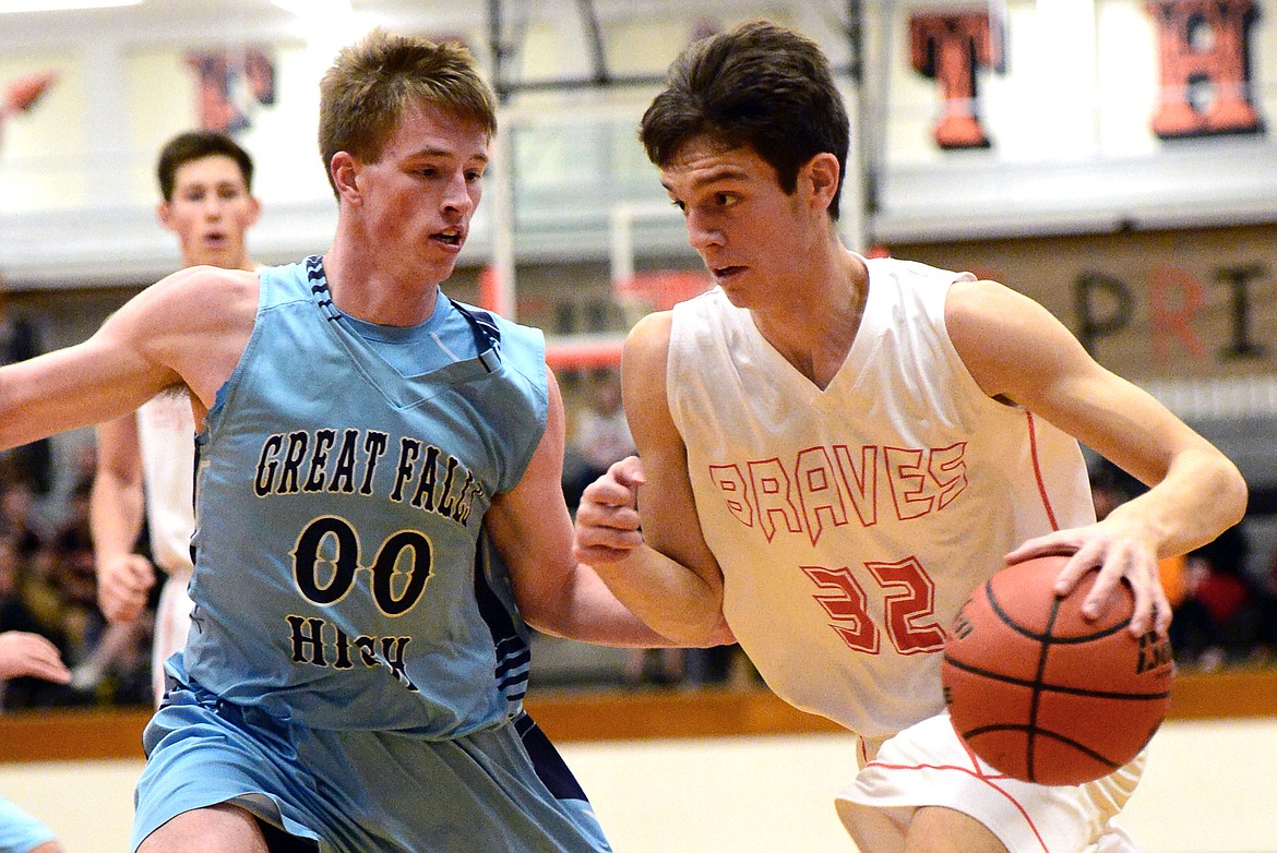 Flathead&#146;s Tyler Johnson dribbles around Great Falls defender Hunter McKinney in the first quarter. (Casey Kreider/Daily Inter Lake)