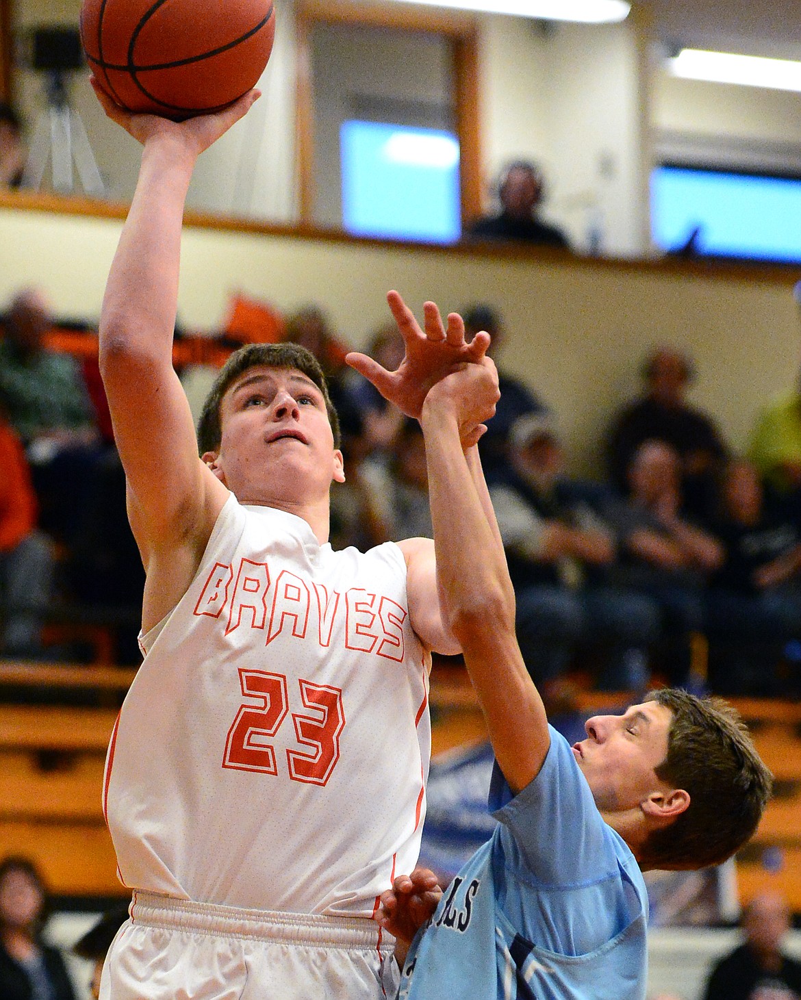 Flathead&#146;s Eric Seaman goes to the hoop past Great Falls defender Cash Abbott. (Casey Kreider/Daily Inter Lake)