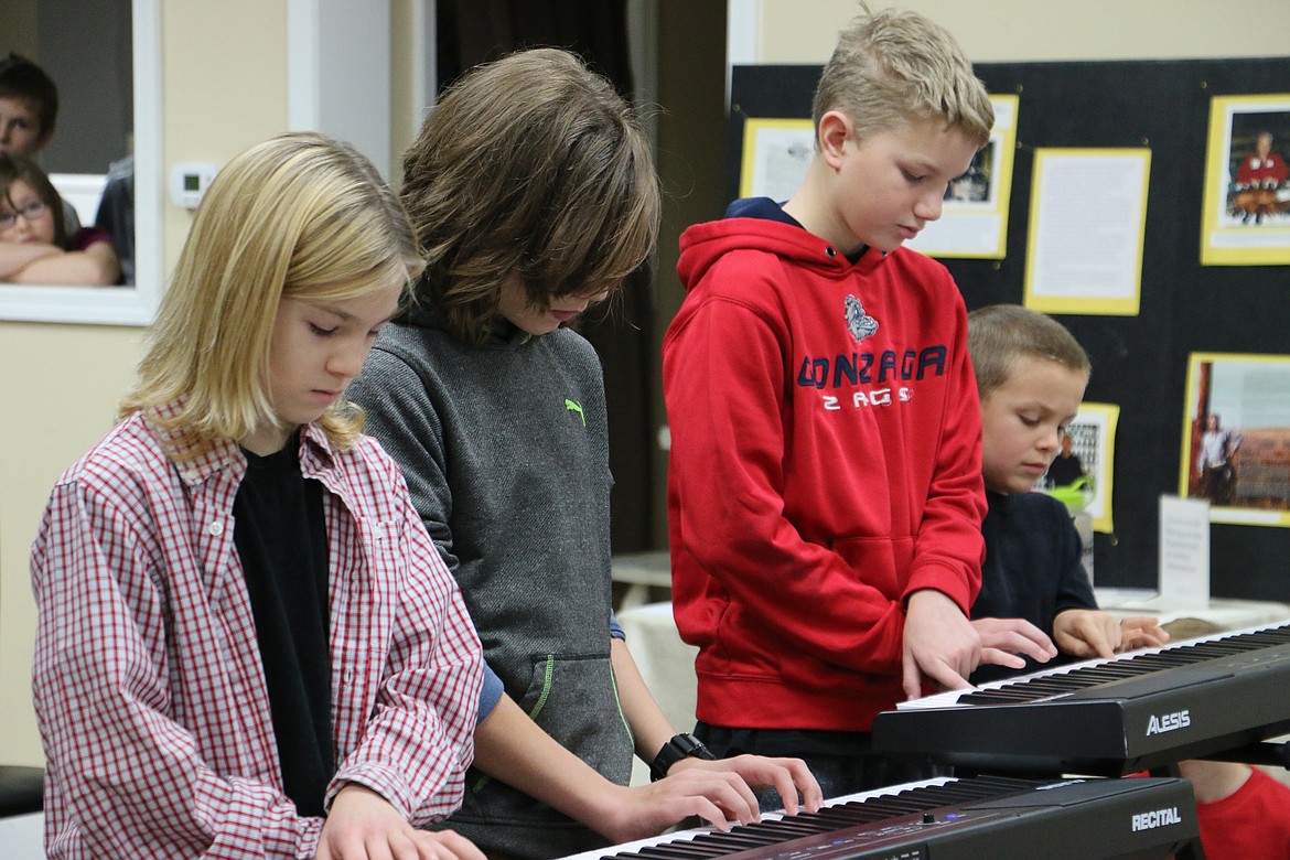 (Photo by MARY MALONE)
Home School Academy students performed the &quot;Star Wars&quot; theme song on the piano during the HSA &quot;All School Revue&quot; on Wednesday.