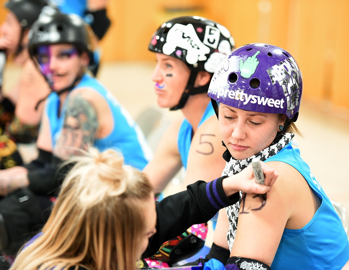 Christina Thiem (Luscious Luciano) gives Danika Pietron (Shotta Petron) her number before the match on Saturday, November 18, at the Flathead County Fairgrounds.(Brenda Ahearn/Daily Inter Lake)