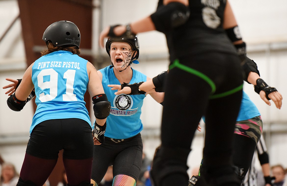 Team Captain Kari Hammer (Hammer) yells directions to her teammates during the match against the Snake Pit Derby Dames of Coeur d&#146;Alene on Saturday, November 18, at the Flathead County Fairgrounds. &#147;Playing Roller Derby effetely requires a great deal of communication,&#148; said Hammer. When she is playing in this position she has the best line of sight to give her team warnings about what the other teams Jammer is doing.(Brenda Ahearn/Daily Inter Lake)