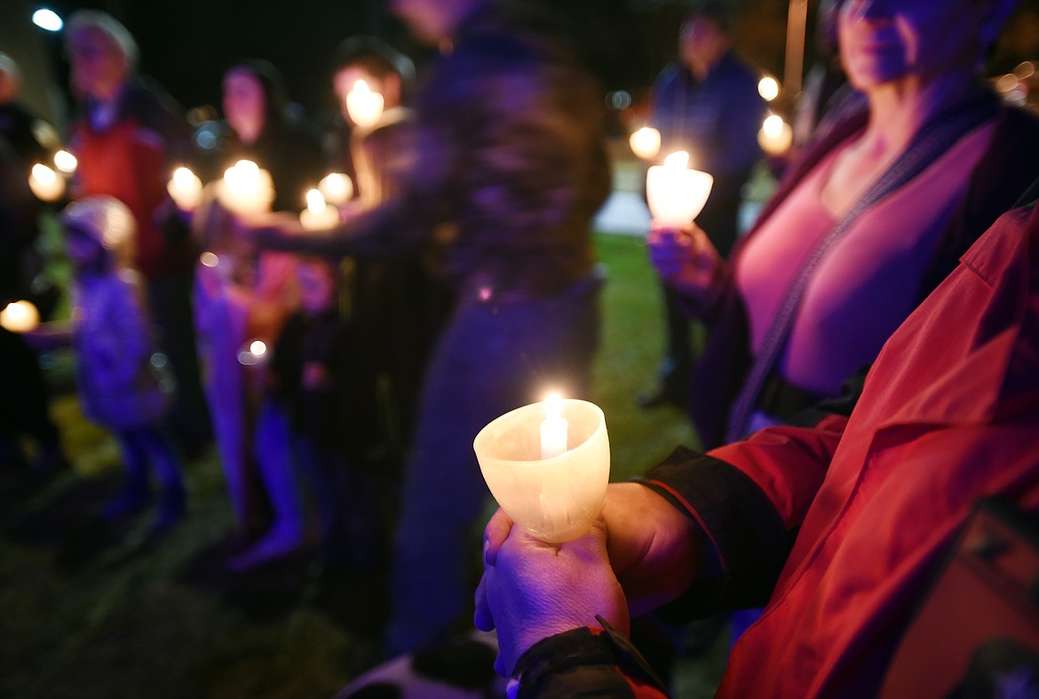 Candles are lit in memory of fallen law enforcement officers during the annual tree-lighting ceremony outside the Flathead County Sheriff&#146;s Office in Kalispell.