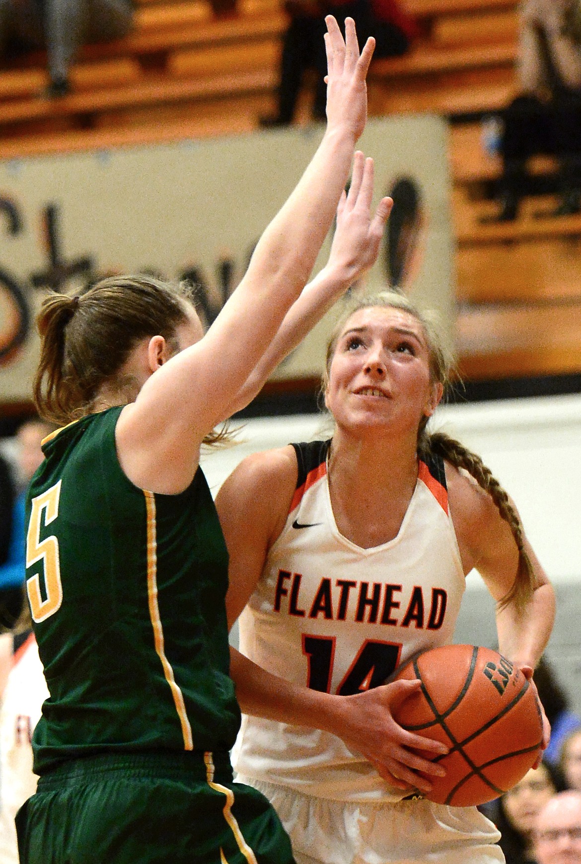 Flathead's Mary Heaton looks for a shot against C.M. Russell defender Kylie Allen. (Casey Kreider/Daily Inter Lake)