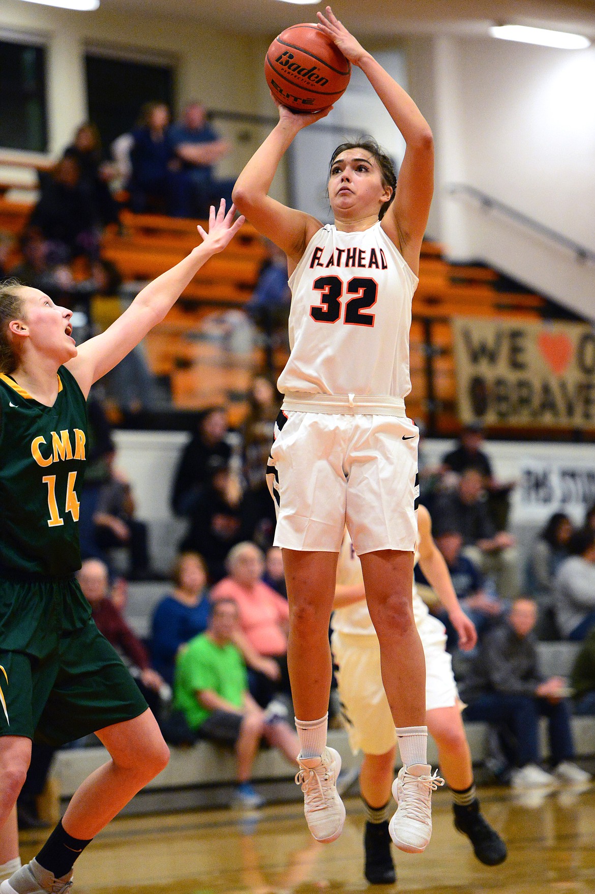 Flathead's Taylor Henley looks to shoot in front of C.M. Russell defender Allie Olsen during the first half. (Casey Kreider/Daily Inter Lake)