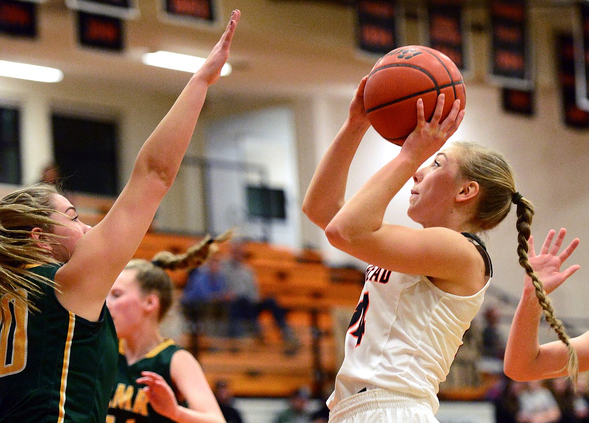 Flathead's Mary Heaton pulls up for two points in the first half against C.M. Russell. (Casey Kreider/Daily Inter Lake)