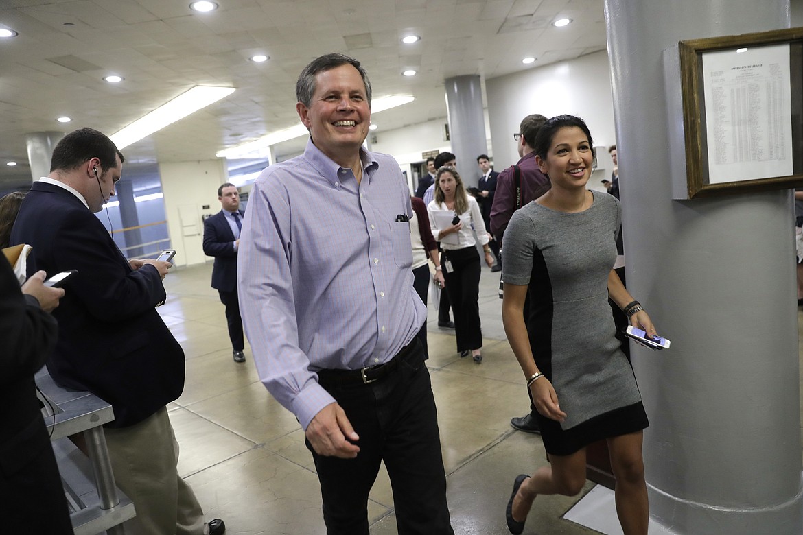 FILE - In this June 22, 2017, file photo, Sen. Steve Daines, R-Mont., walks to the floor for votes at the Capitol in Washington, Thursday, June 22, 2017. Sen. Bob Corker is hardly the only Republican lambasting Donald Trump and raising dark concerns about harm the president might cause the U.S. and the world. He&#146;s just the only one who&#146;s sounding off in public. A couple Republican senators who did have something to say on Oct, 9 aligned themselves with Trump, not Corker. Daines &#147;has confidence in the president,&#148; his office said. (AP Photo/J. Scott Applewhite, File)