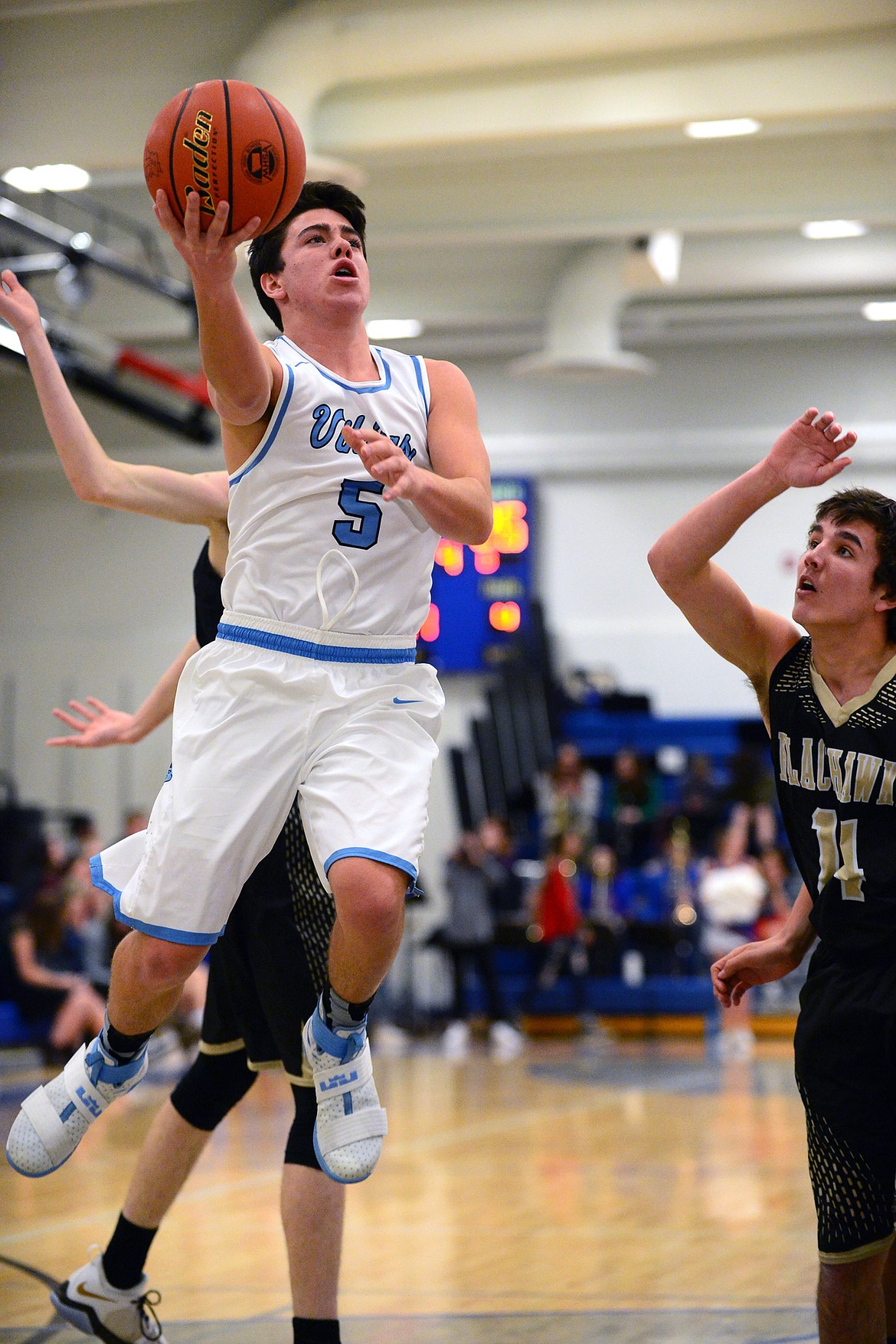 Bigfork's Luke Schmit (5) goes to the hoop against Seeley-Swan on Tuesday night in Bigfork. (Casey Kreider/Daily Inter Lake)