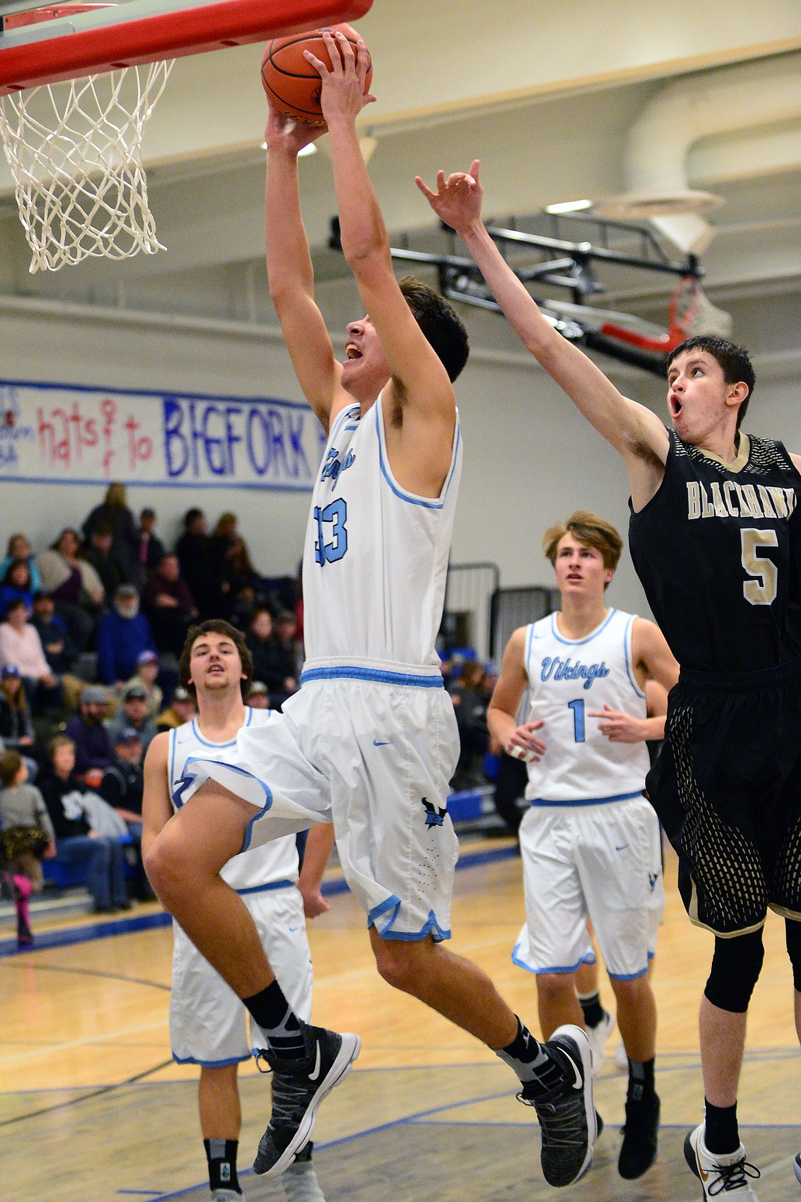 Bigfork's Beau Santistevan (33) throws down a dunk in front of Seeley-Swan defender Cordell Turner (5) Tuesday night in Bigfork. (Casey Kreider/Daily Inter Lake)