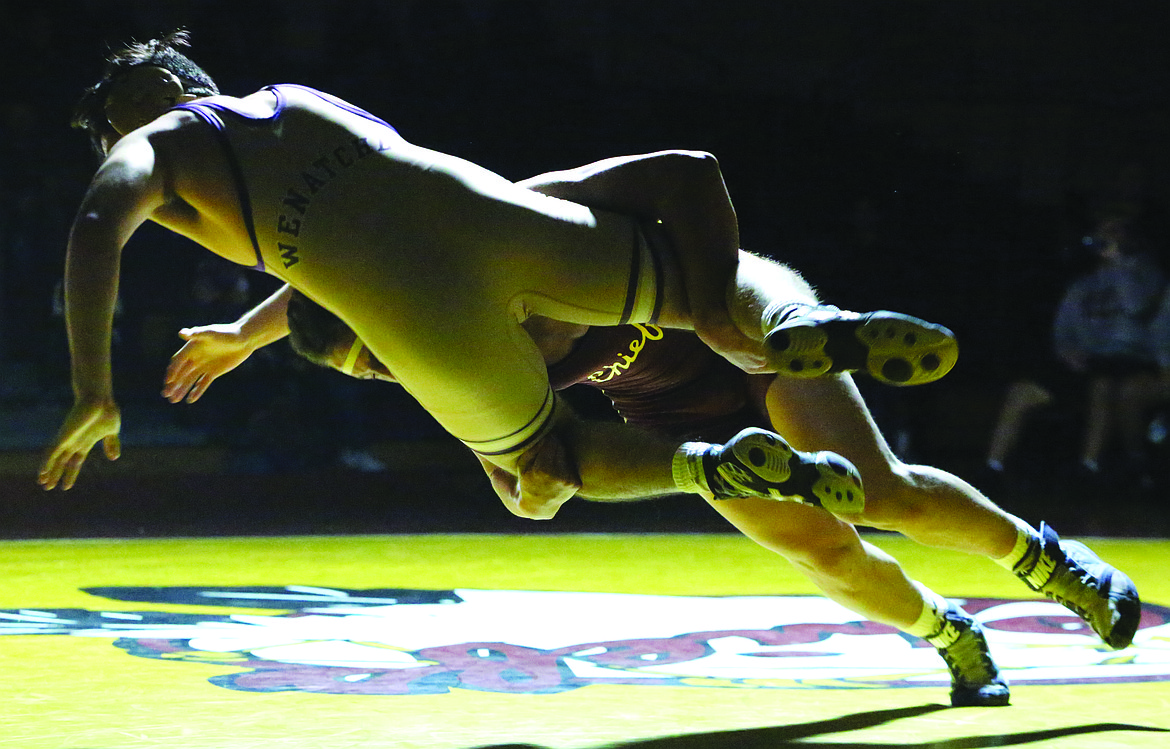 Connor Vanderweyst/Columbia Basin Herald
Moses Lake's BJ Mullin takes down Wenatchee's Pedro Acevedo.