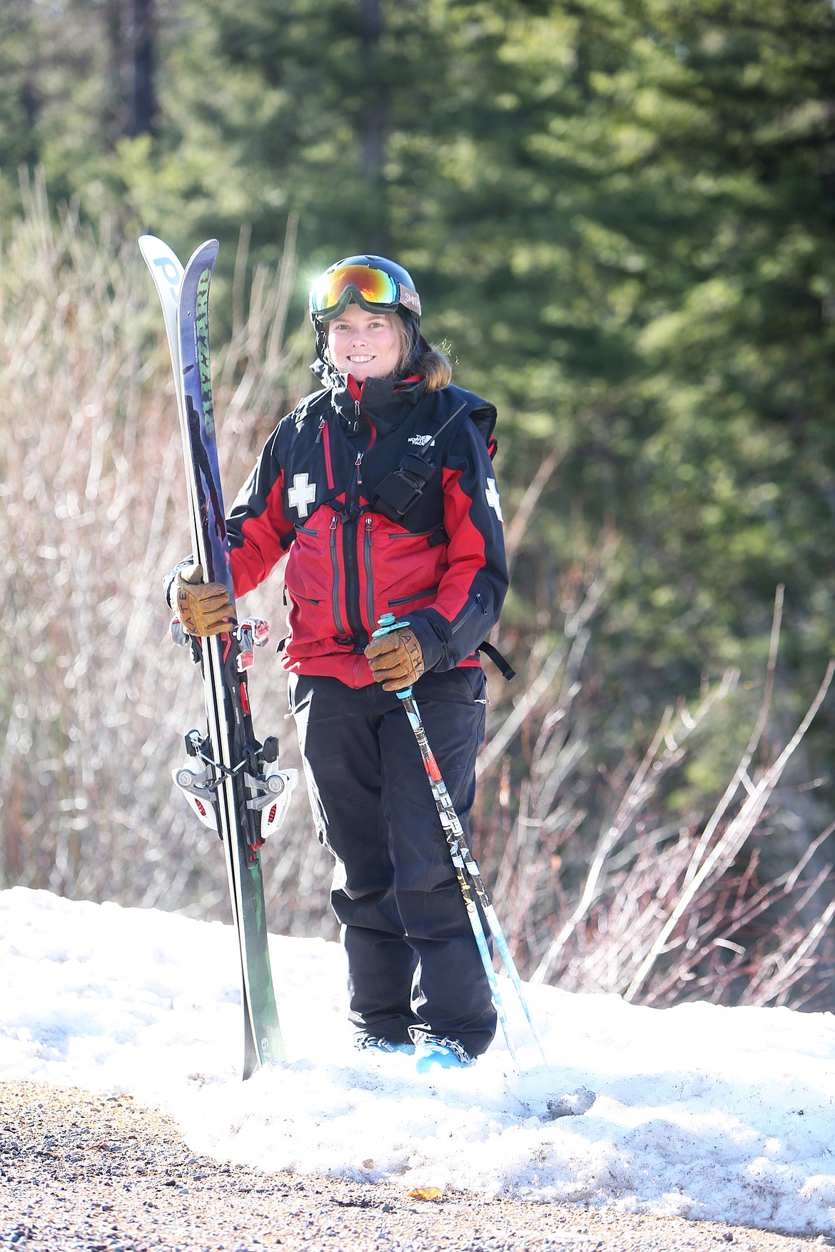 Kate Atha, 30, of the Whitefish Mountain Resort Ski Patrol poses for a portrait near the base lodge, Tuesday, Nov. 28. (Mackenzie Reiss/Daily Inter Lake)