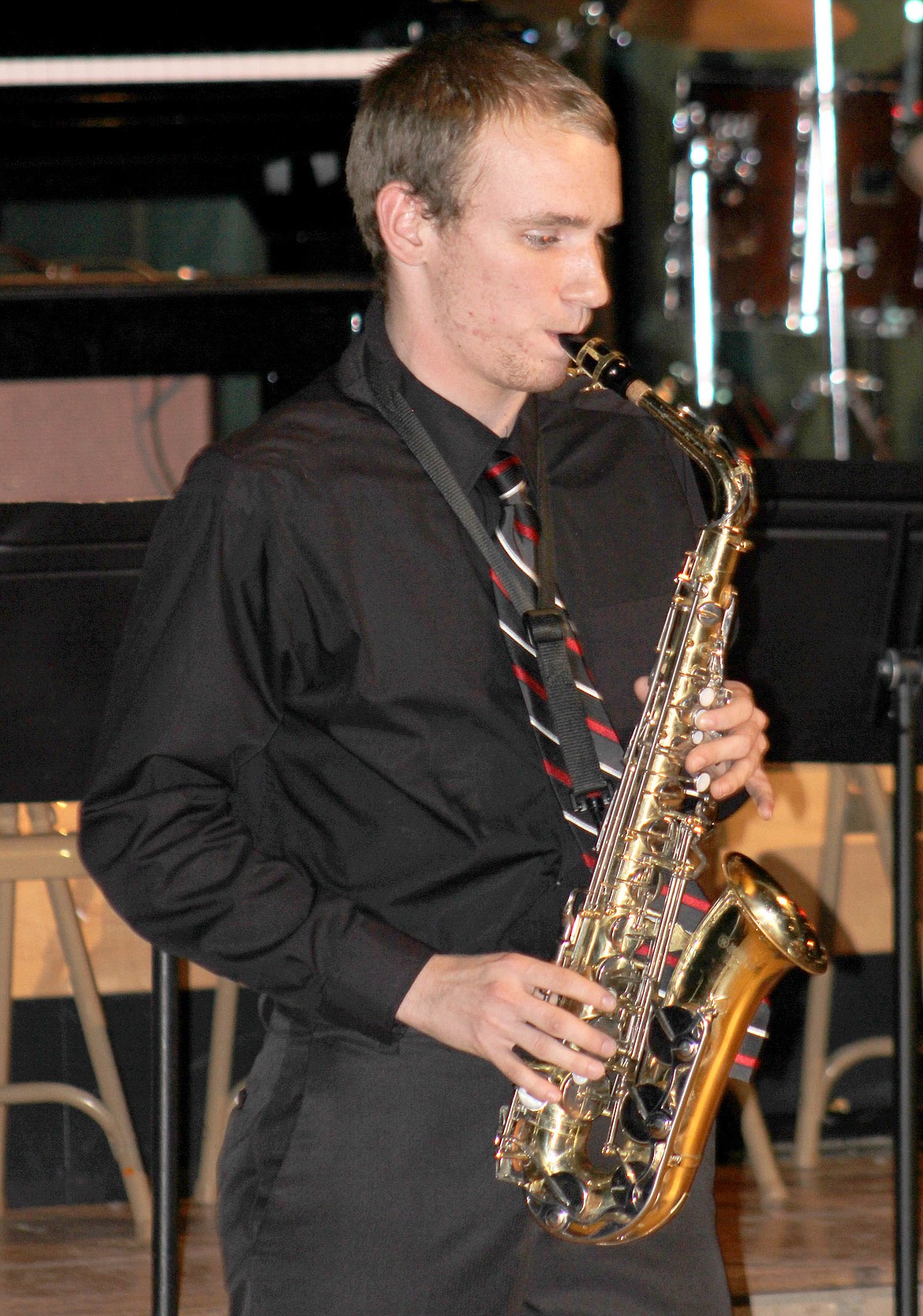 Left: Jonathan White plays saxophone at the annual Libby High School dessert concert Tuesday, Dec. 5 at the Libby Memorial Events Center in Libby. (Photo by Sarah Barrick)
