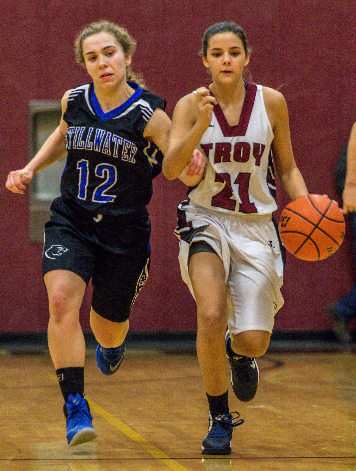 Stillwater&#146;s Cora Boll, left, tries to get control of the ball from Troy&#146;s Talise Becquart on Tuesday in Troy. (John Blodgett/The Western News)