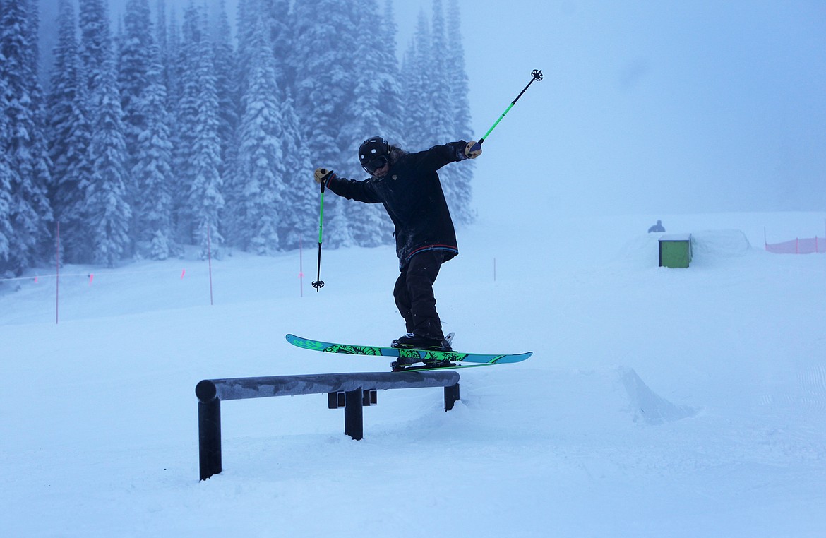 A skier grinds on a rail in the terrain park on Whitetail during opening day at Whitefish Mountain Resort. (Mackenzie Reiss/Daily Inter Lake)