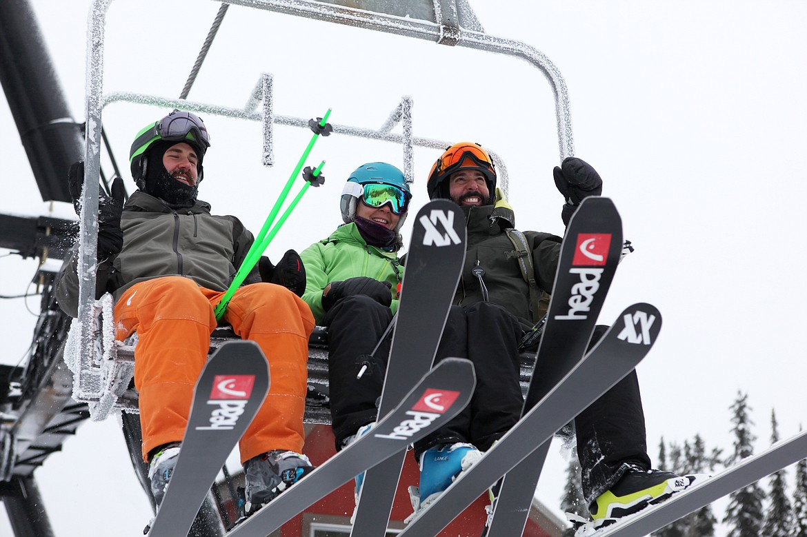 A trio of skiiers are among the first to break in Chair 5 on Whitefish Mountain Resort. (Mackenzie Reiss/Daily Inter Lake)