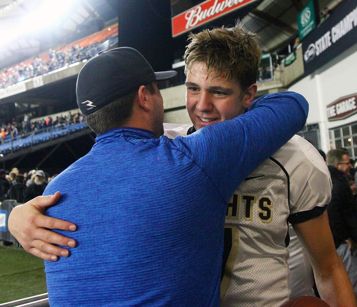 Rodney Harwood/Columbia Basin Herald
Royal quarterback Sawyer Jenks is congratulated after the Knights won the 1A state championship on Saturday in the Tacoma Dome. It was Royal's third consecutive state title