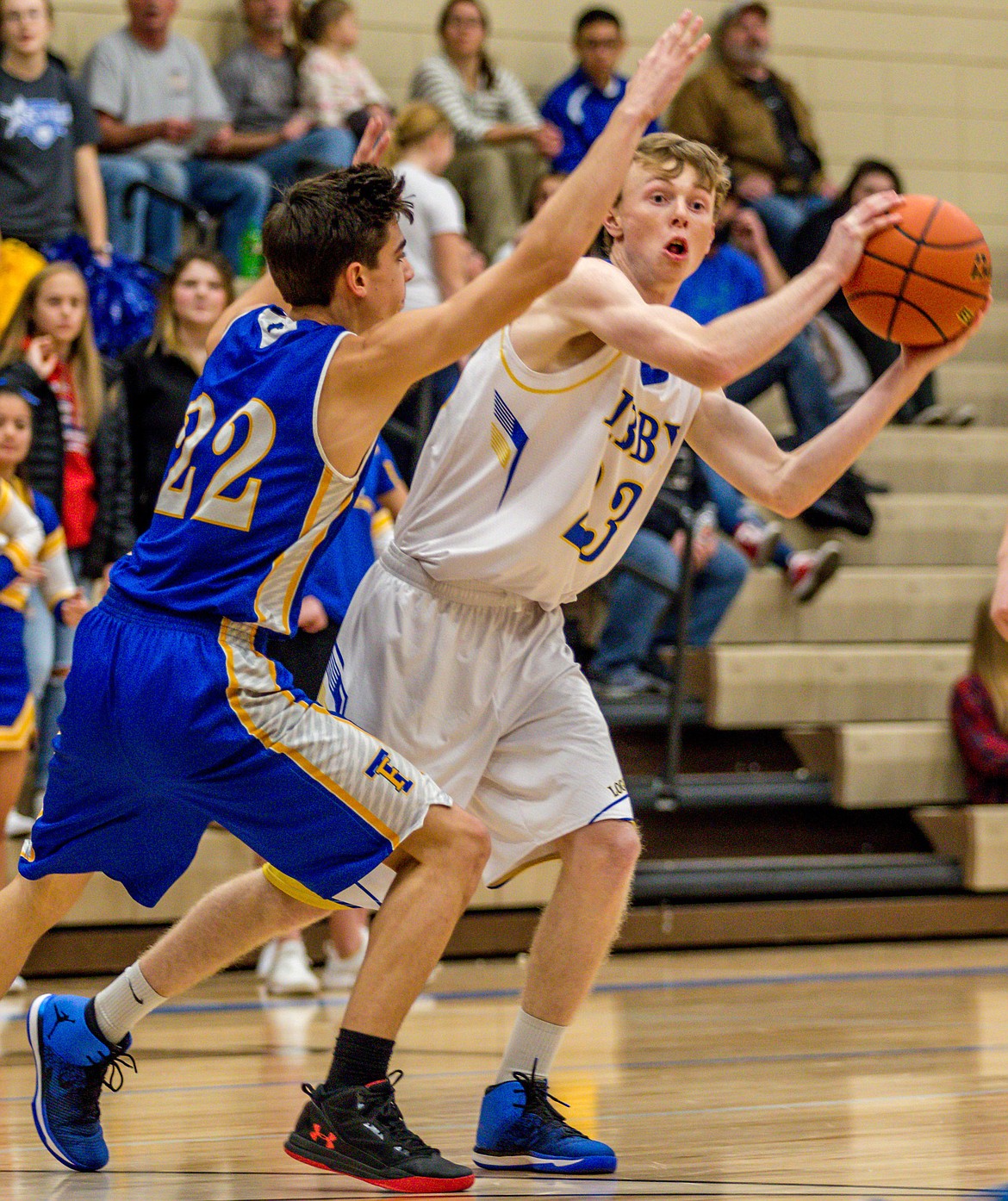 Libby&#146;s Ryggs Johnston, right, looks for an open teammate while guarded by Thompson Falls&#146; Alex Erosa during the first quarter Saturday. (John Blodgett/The Western News)