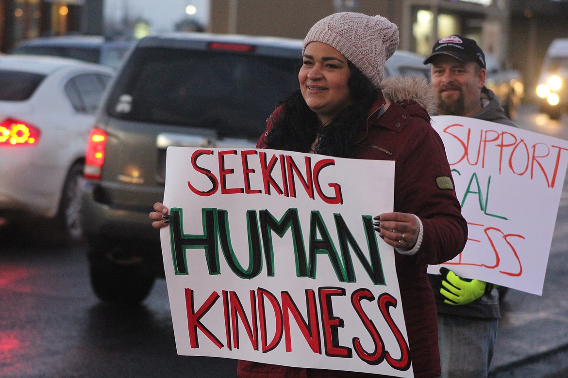 Richard Byrd/Columbia Basin Herald
Volunteers lined Stratford Road in Moses Lake Thursday night to raise funds and donations for the Warming Center during the third annual Sleep on the Street event.