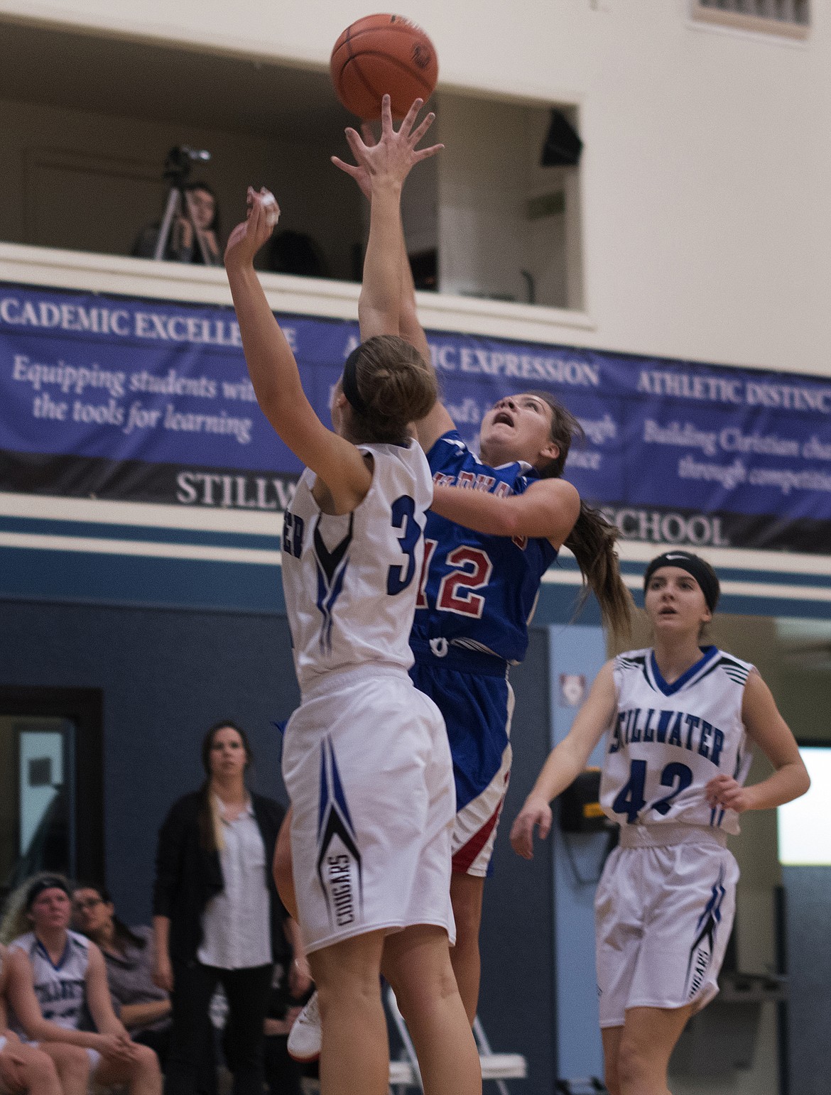 Wildkat LaKia Hill goes up for a tough shot over a Stillwater Christian defender Saturday. (Jeremy Weber photo)