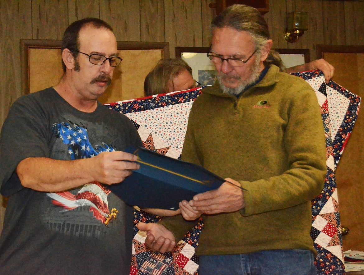Medric Jones is presented a quilt from the Quilts of Valor program at the Plains VFW on Saturday. (Erin Jusseaume photos/Clark Fork Valley Press)