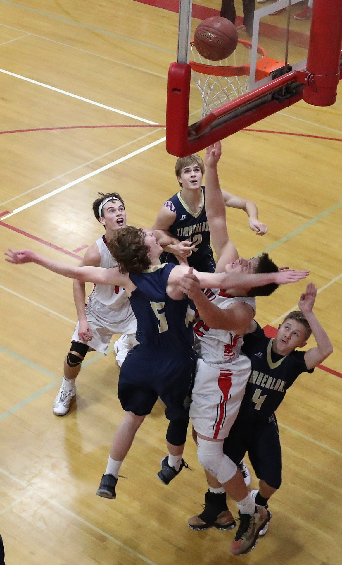 (Photo by ERIC PLUMMER)
Alex Stockton draws a crowd of defenders for two of his 17 points on the night.