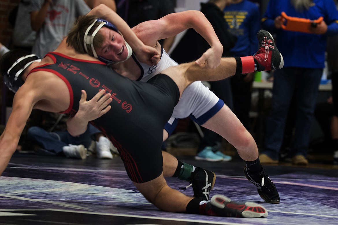 Columbia Falls wrester Nathan Hader competes Saturday at the Owen Invitational in Polson. Hader won his first match but fell in his second. (Jeremy Weber photo)