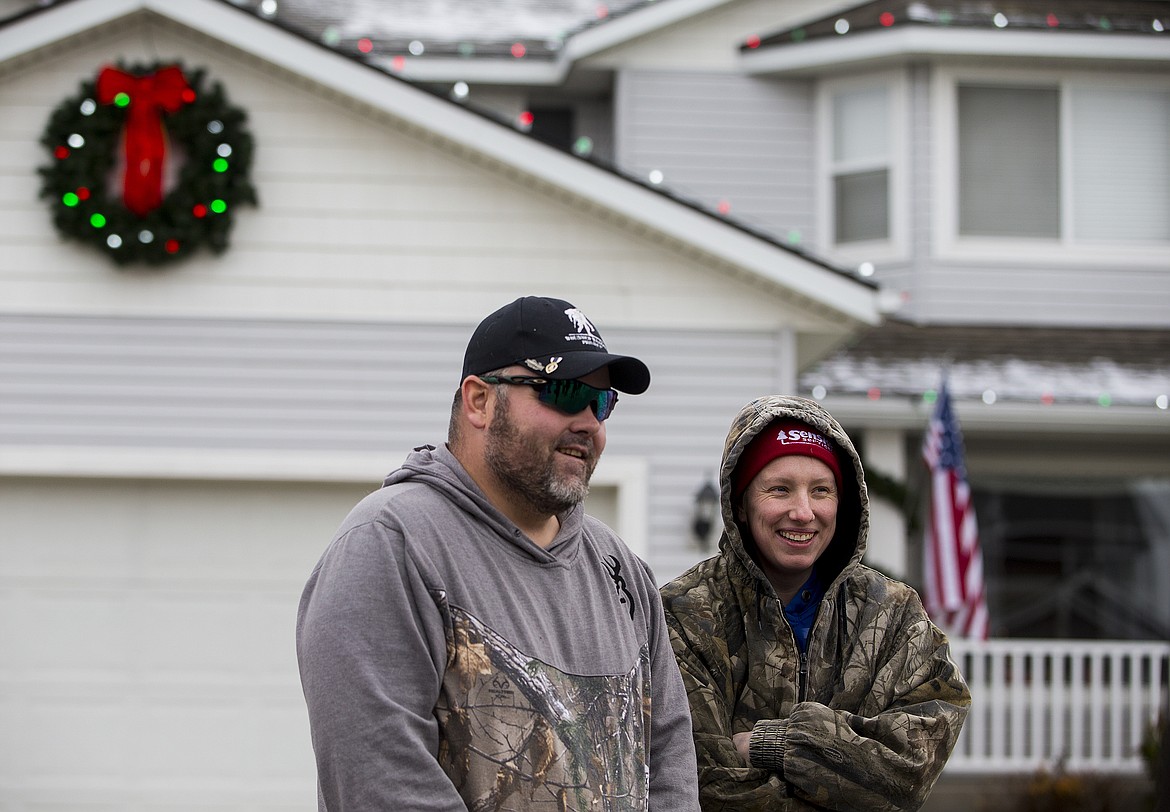 Photos: LOREN BENOIT/Press
Donald and Courtney Sohler speak with the press Thursday in Coeur d&#146;Alene. Donald&#146;s wife nominated her family for the Decorated Family Program, a national program created by Christmas Decor to thank our country&#146;s soldiers for their dedication and support. A Senske Service crew decorated the house &#151; seen below on Thursday night &#151; with more than 300 feet of LED lights and a hanging wreath.