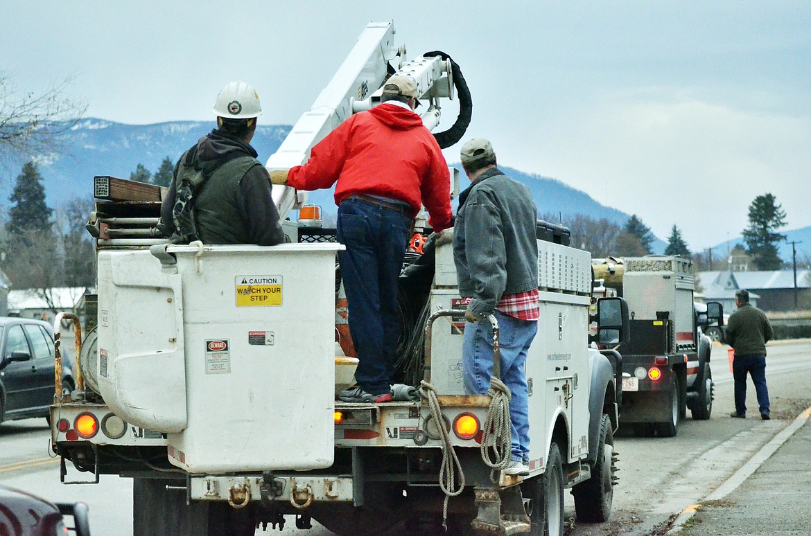 Local electric company, and fire department helped the Plains Lion&#146;s Club bring some Christmas magic to Plains on Sunday as they worked to decorate the whole town. (Erin Jusseaume/ Clark Fork Valley Press)