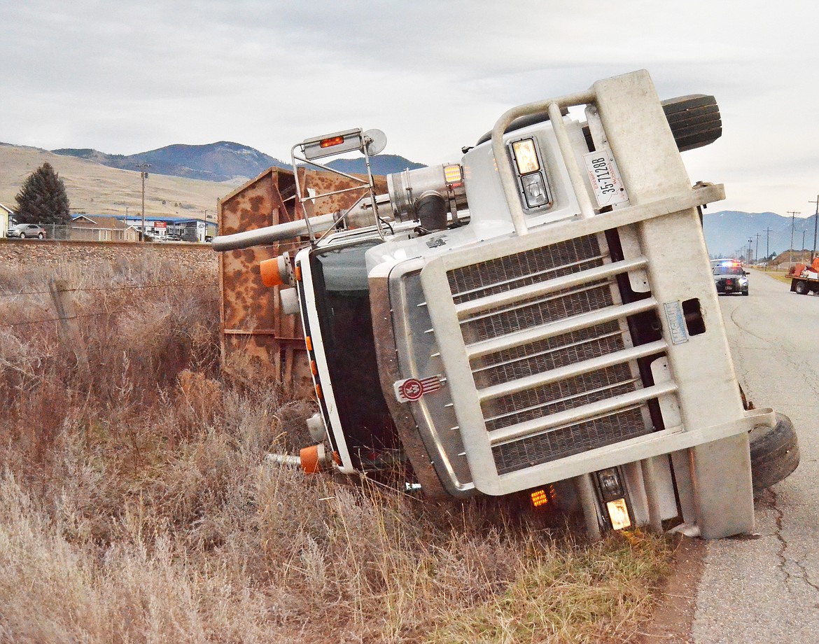 A dump TRUCK rolled over on Airport Road in Plains last week. The driver was charged with distracted driving. (Erin Jusseaume/ Clark Fork Valley Press)