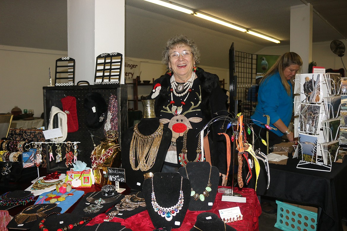 Photo by Mandi Bateman
Nancy Martinez with her booth, NancyAnn&#146;s Bling Bling Jewelry, was bursting with holiday spirit.