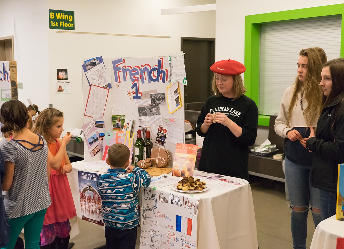 Students from French I offer some tasty treats to younger students during the event at Whitefish High School.