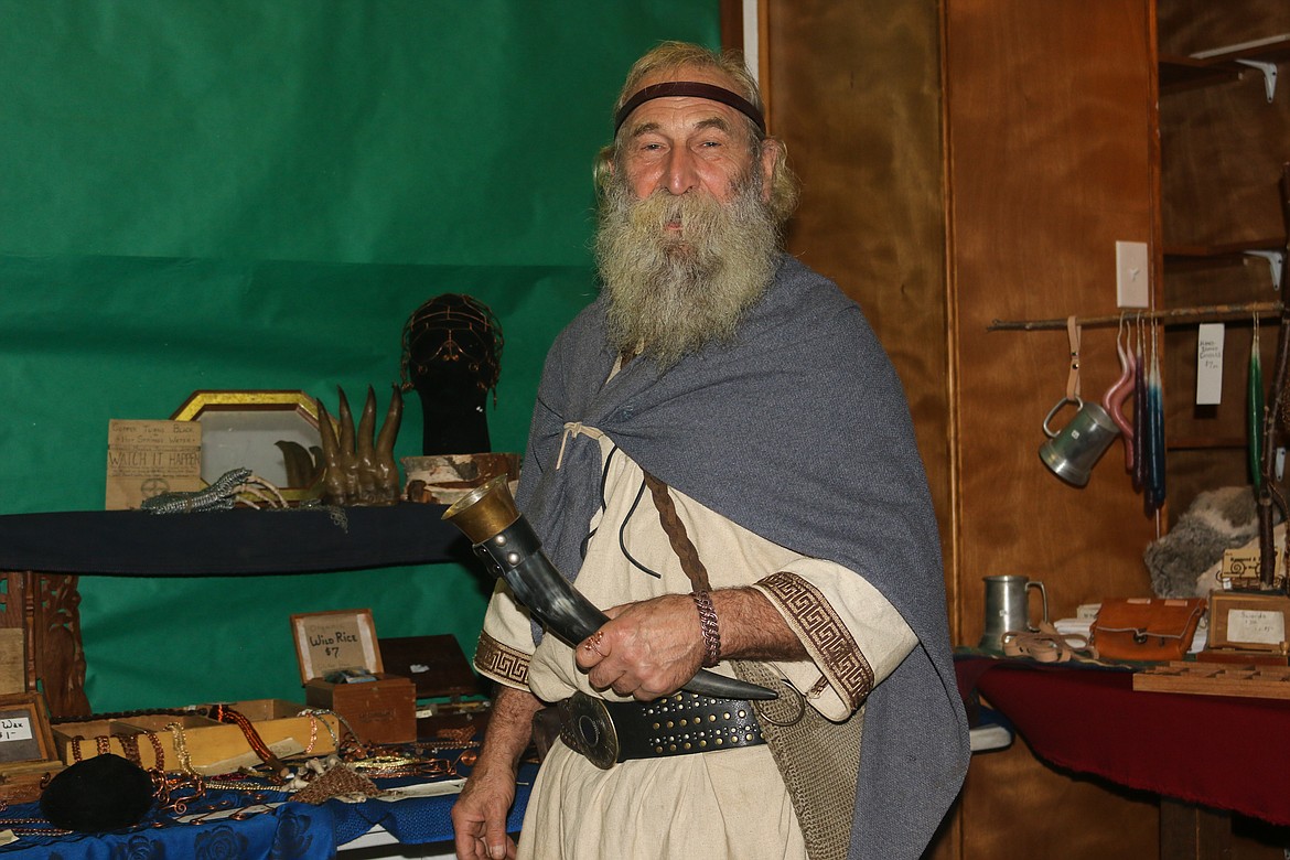 Photo by Mandi Bateman
Weezil with his booth, Hammered and Twisted Copper Jewelry.