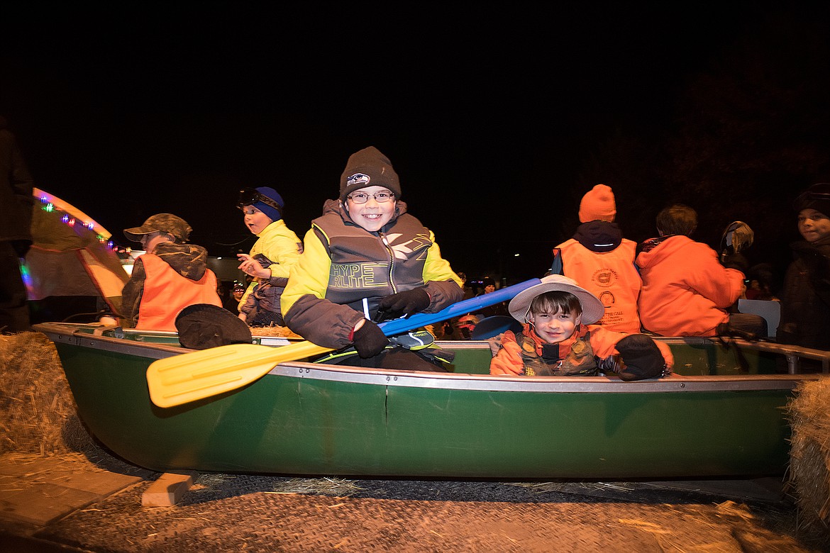 Cub Scouts row through the parade.