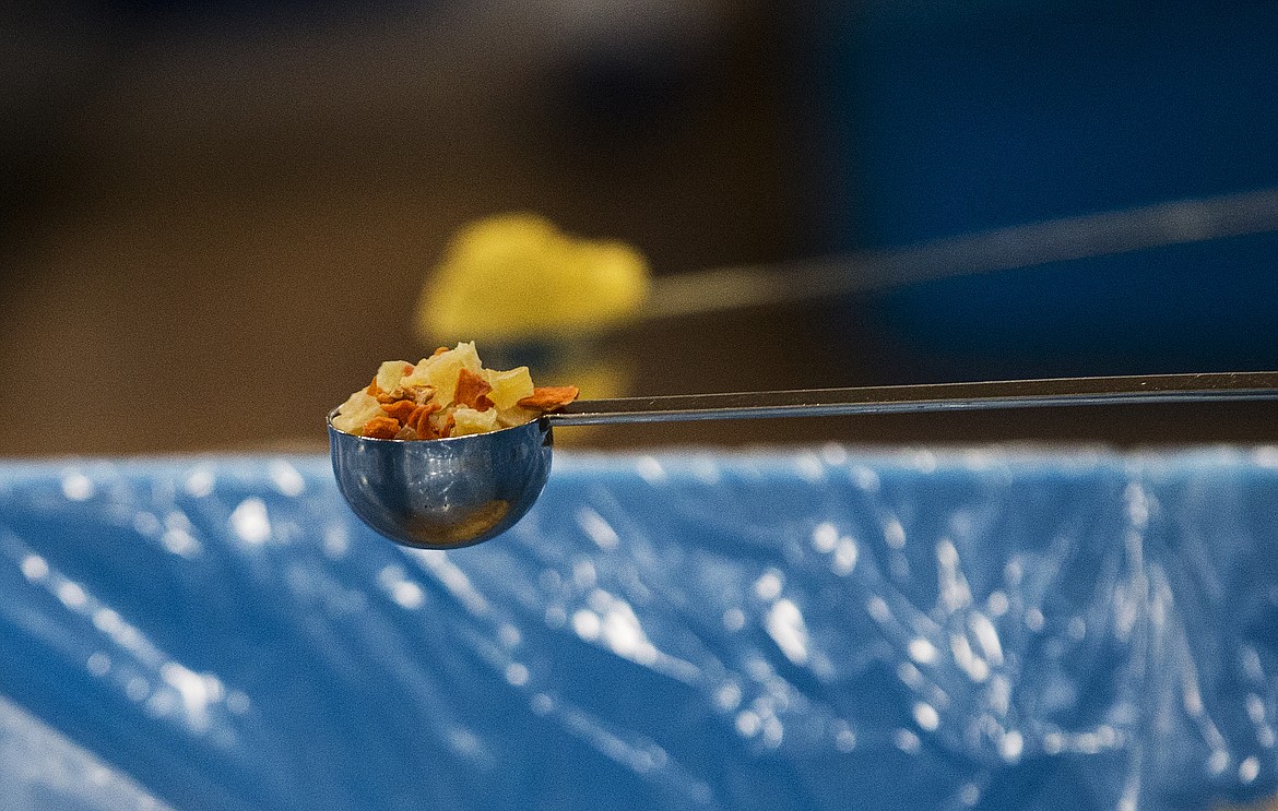 The meal packs contain dried vegetables (shown here), soy, rice, and other ingredients. (LOREN BENOIT/Press)