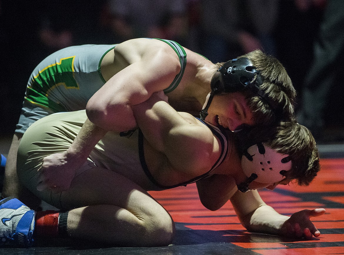 LOREN BENOIT/Press

Lakeland&#146;s William Edelblute grapples with Mead&#146;s Chase Tebbets in the 120 pound Tr-State match on Saturday at North Idaho College.