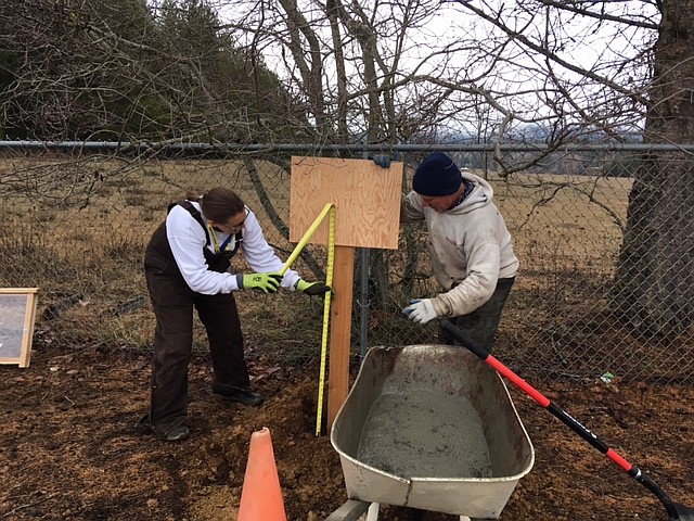 (Courtesy photo)
Volunteers measure one of the storyboards for the new StoryWalk added at Northside Elementary.