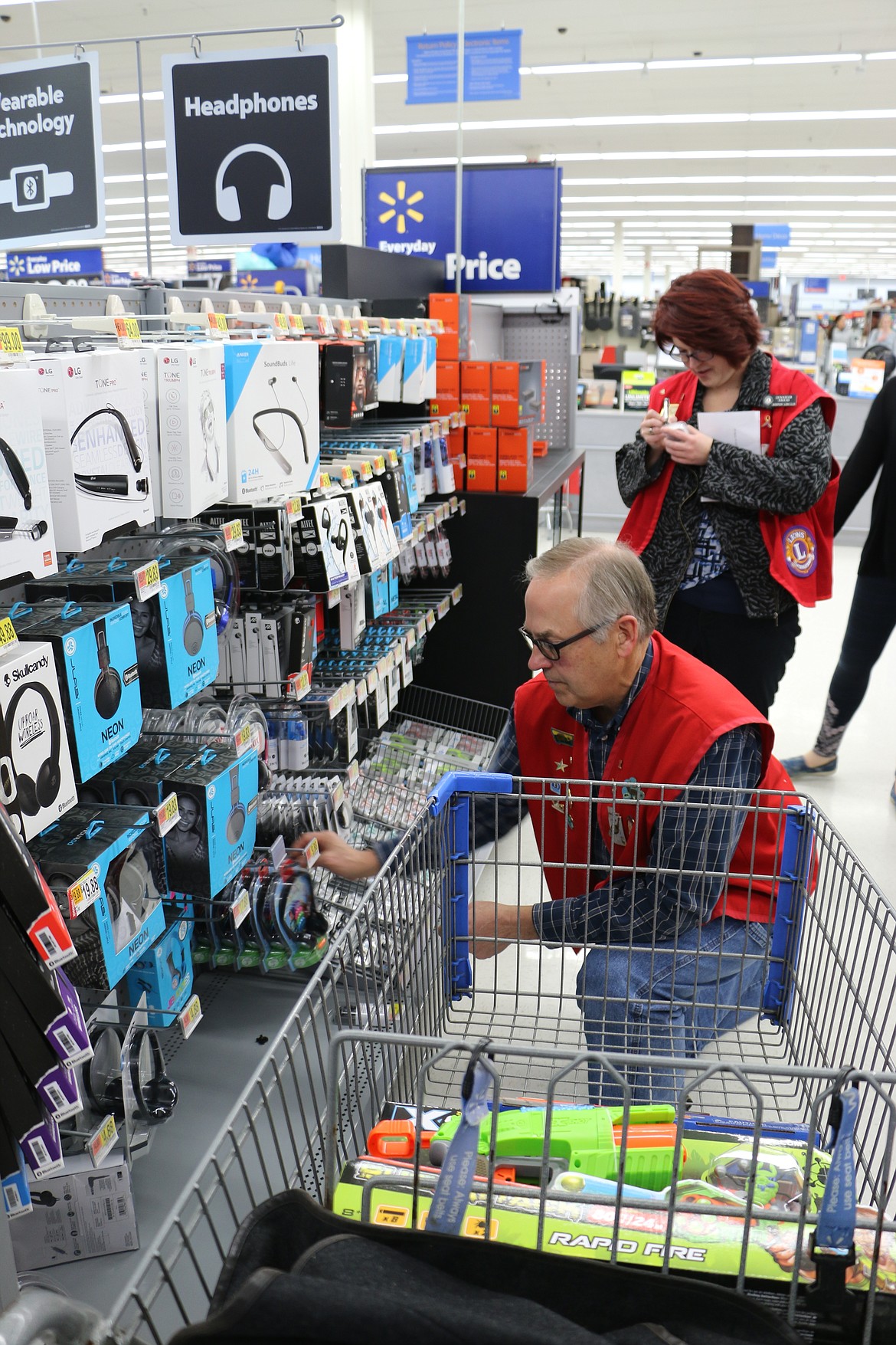 (Photo by MARY MALONE)
Sandpoint Lions Club members and volunteers arrived en masse at Walmart on Dec. 7 to do a little Christmas shopping for Toys for Tots.