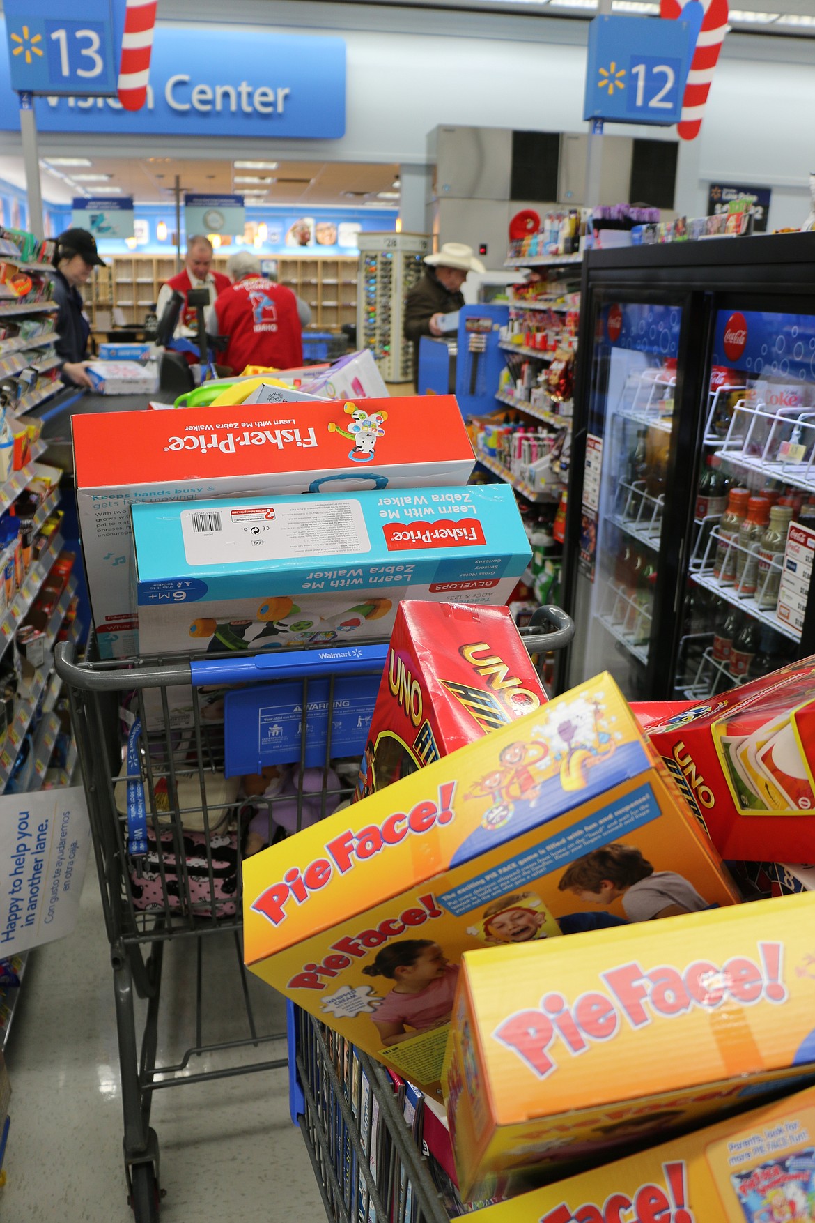 (Photo by MARY MALONE)
A dozen or more carts were filled by Sandpoint Lions Club members and volunteers as they spent about $13,000 on toys on Dec. 7 to help fill the Lions Den for the club's annual Toys for Tots campaign.