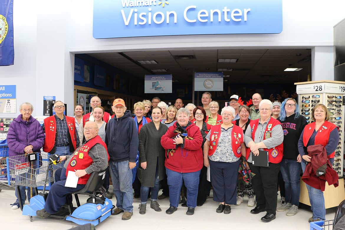 (Photo by MARY MALONE)
Sandpoint Lions Club members and volunteers pose for a group photo after buying goys for the club's annual Toys for Tots campaign at Walmart on Dec. 7.