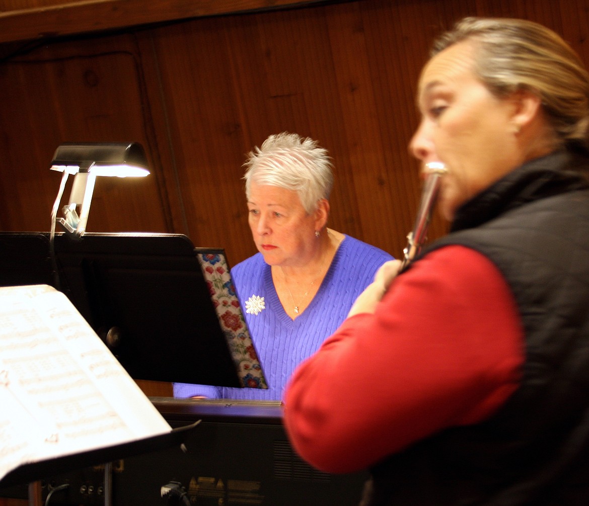 (Photo by DAVID GUNTER)
Group leader Carol Sommerfeld plays keyboard as Sarah Guthrie accompanies the praise band on flute.