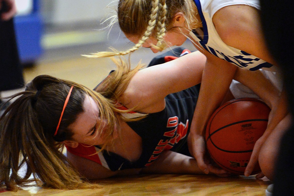 Flathead's Hannah O'Dell and Columbia Falls' Ryley Kehr battle for a loose ball. (Casey Kreider/Daily Inter Lake)