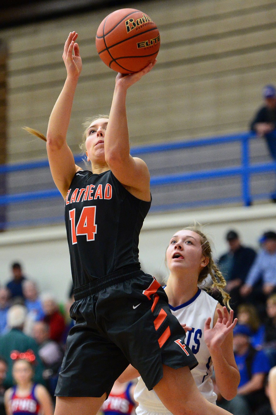 Flathead's Mary Heaton looks to shoot with Columbia Falls' Ryley Kehr trailing. (Casey Kreider/Daily Inter Lake)