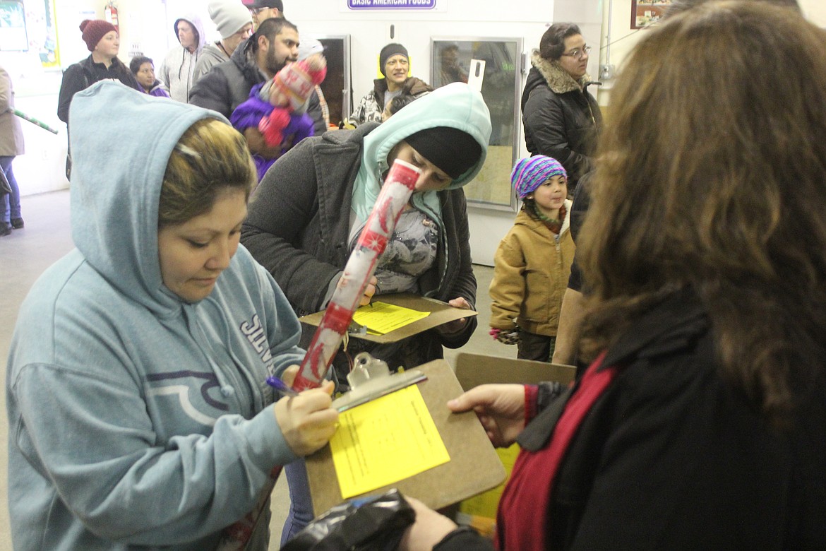 Richard Byrd/Columbia Basin Herald
Unchained Brotherhood club members gave out bags of toys to needy families at the Moses Lake Food Bank on Saturday.