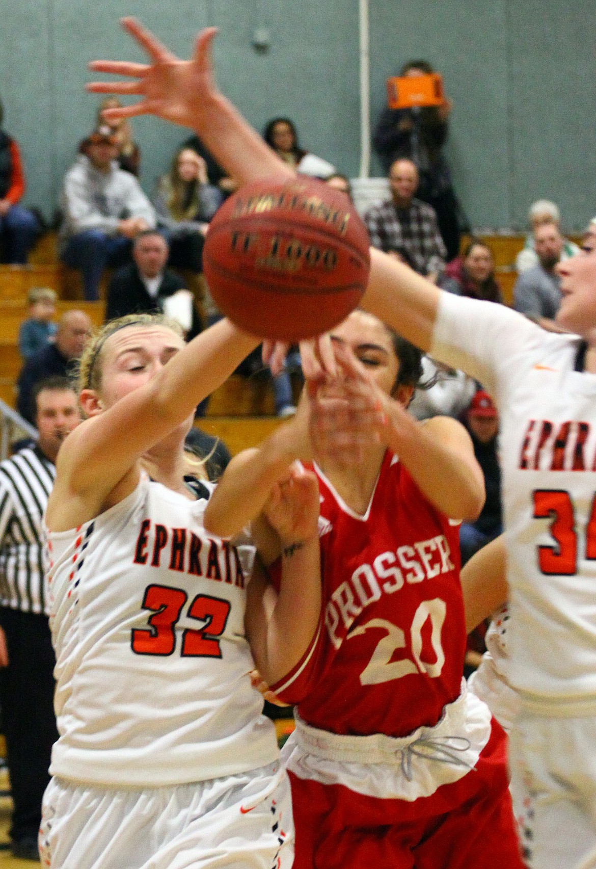 Rodney Harwood/Columbia Basin HeraldEphrata's Sydnee Pixlee (32) battles Madison Golden (20) of Prosser for a rebound during the first quater of Saturday's game.