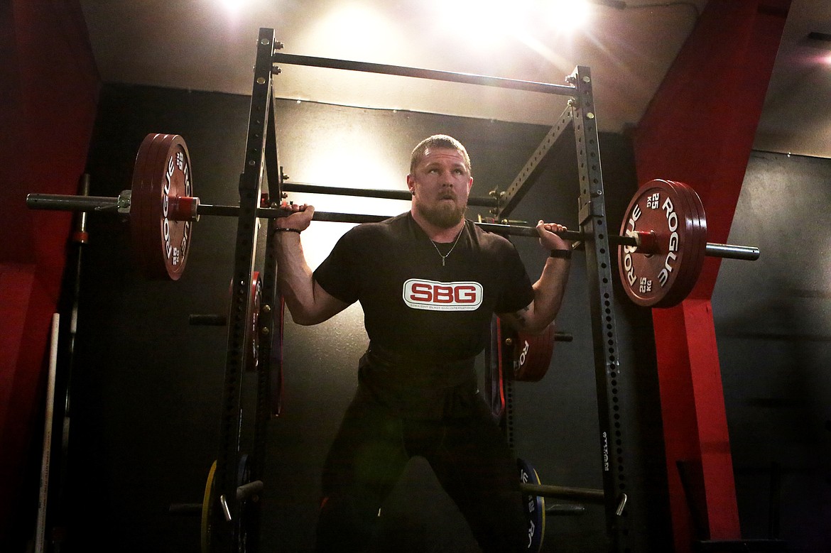 Beast Athletes owner Donny Tudahl squats more than 300 pounds during a practice.