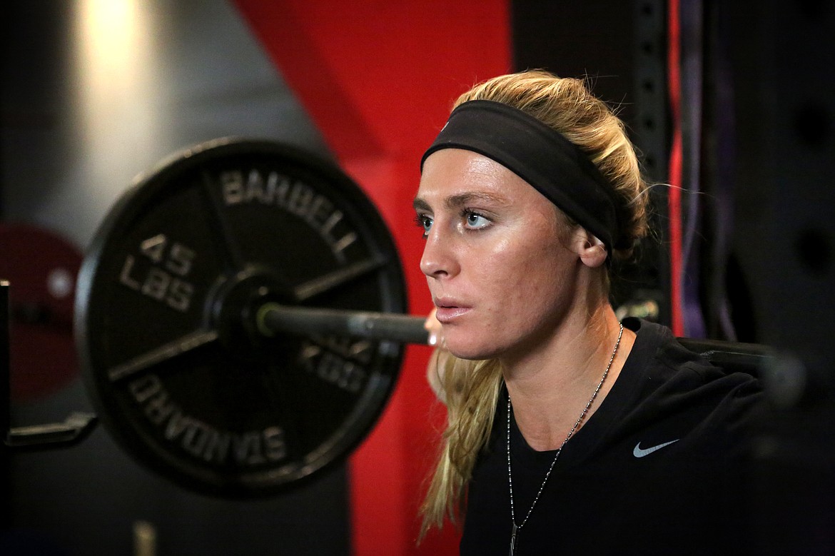 Kristiana Konkol squats during Thursday night practice for the Beast Athletes Powerlifting Team. (Mackenzie Reiss/Daily Inter Lake)