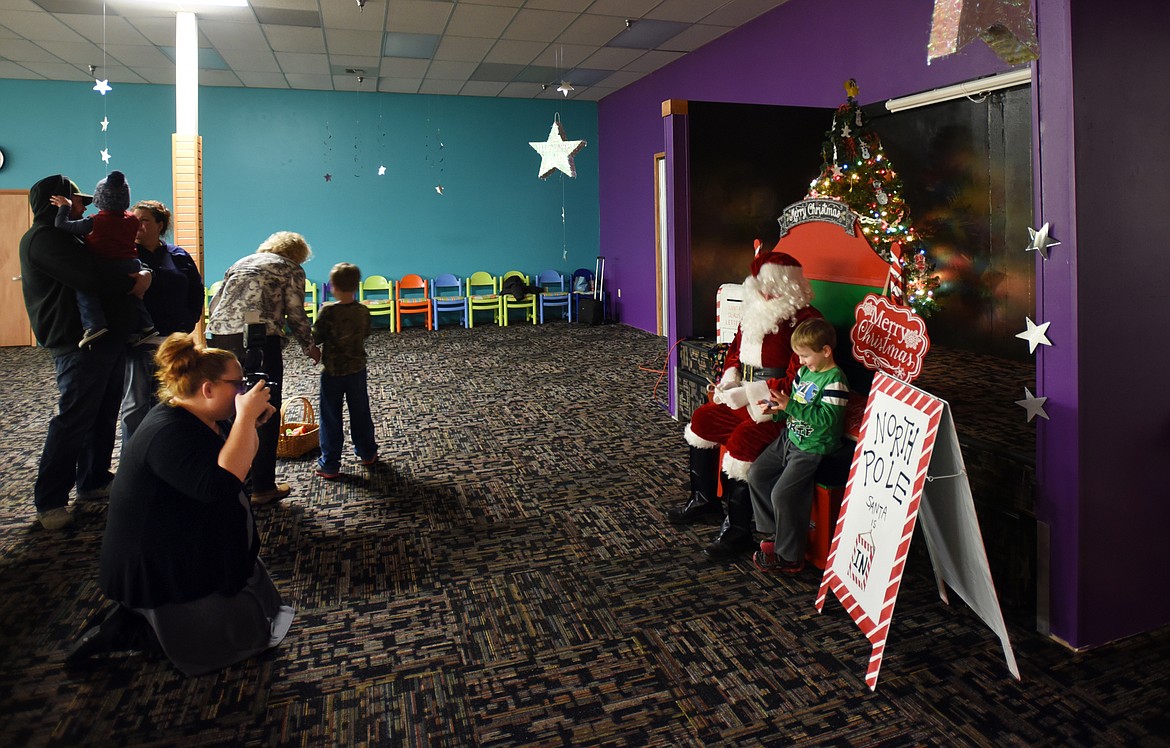 Photographer Kelly Kirksey volunteered to photograph children with Sensory Santa on Thursday evening, Dec. 14, at the Gateway Community Center. &#147;This was really in my heart to be a part of after all of our Santa experiences,&#148; said Kirksey. &#147;I know how important a safe place for your child to feel accepted and comfortable is. These guys certainly pulled that off. These parents didn&#146;t have to worry about people judging them or their kids needing more time to get comfortable with Santa. It was just what they needed.&#148;&#160;
(Brenda Ahearn/Daily Inter Lake)